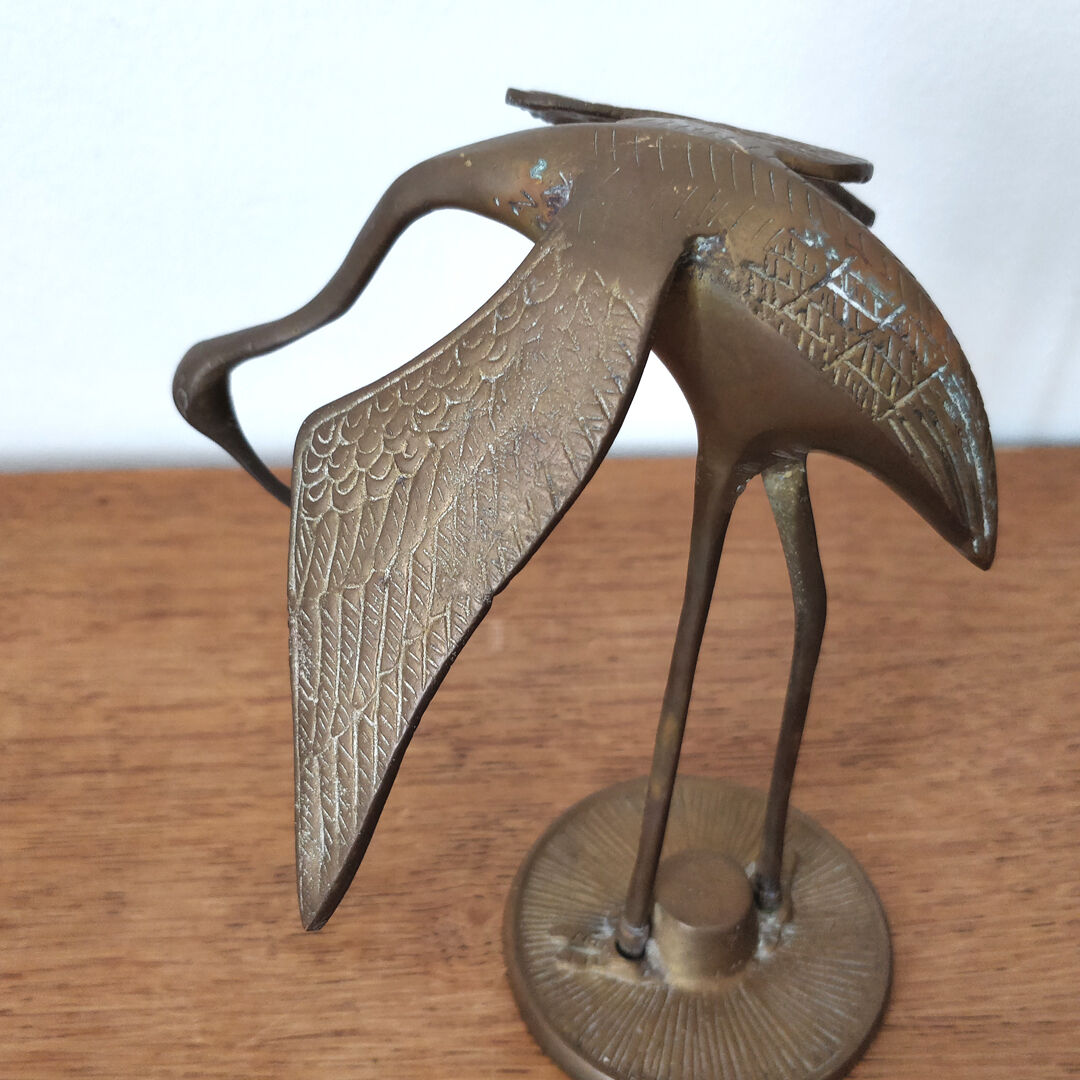 Couple herons in vintage brass
