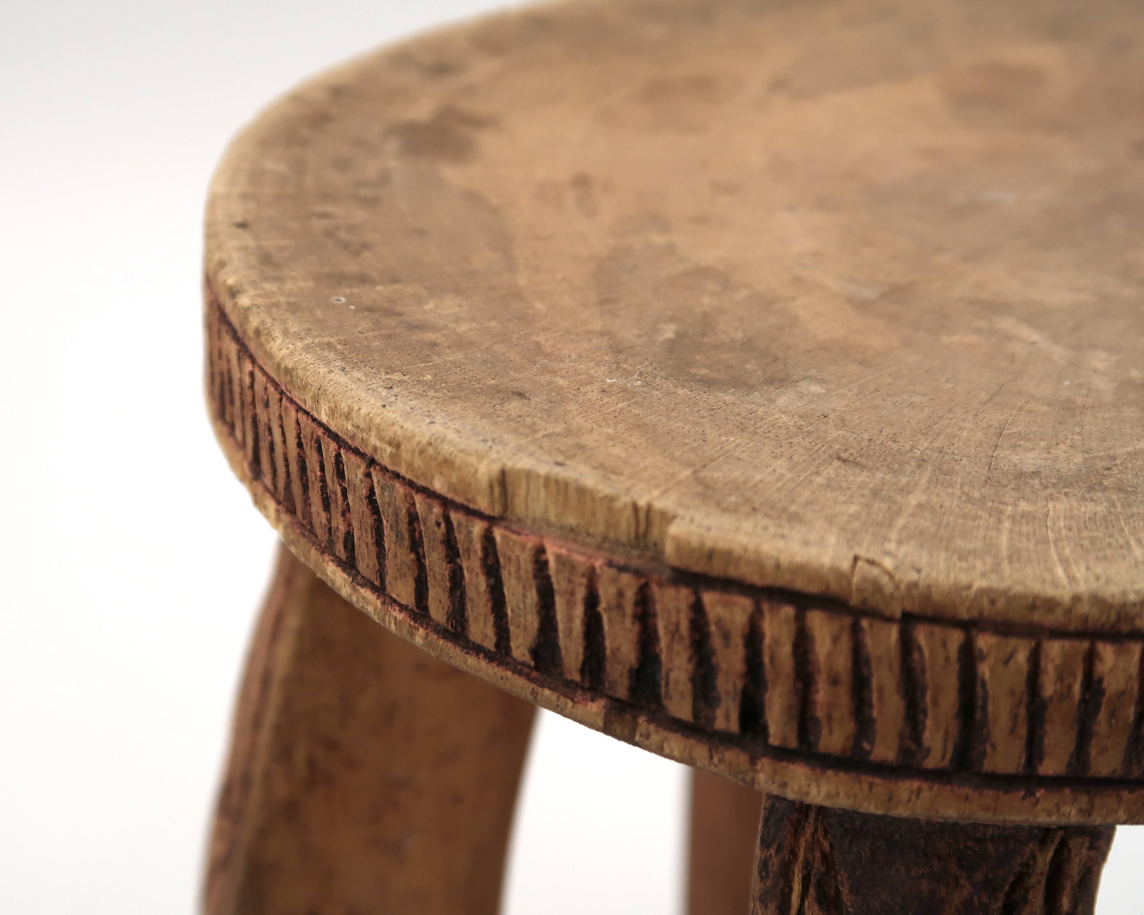 African stool with scarified wooden decoration, 1980s