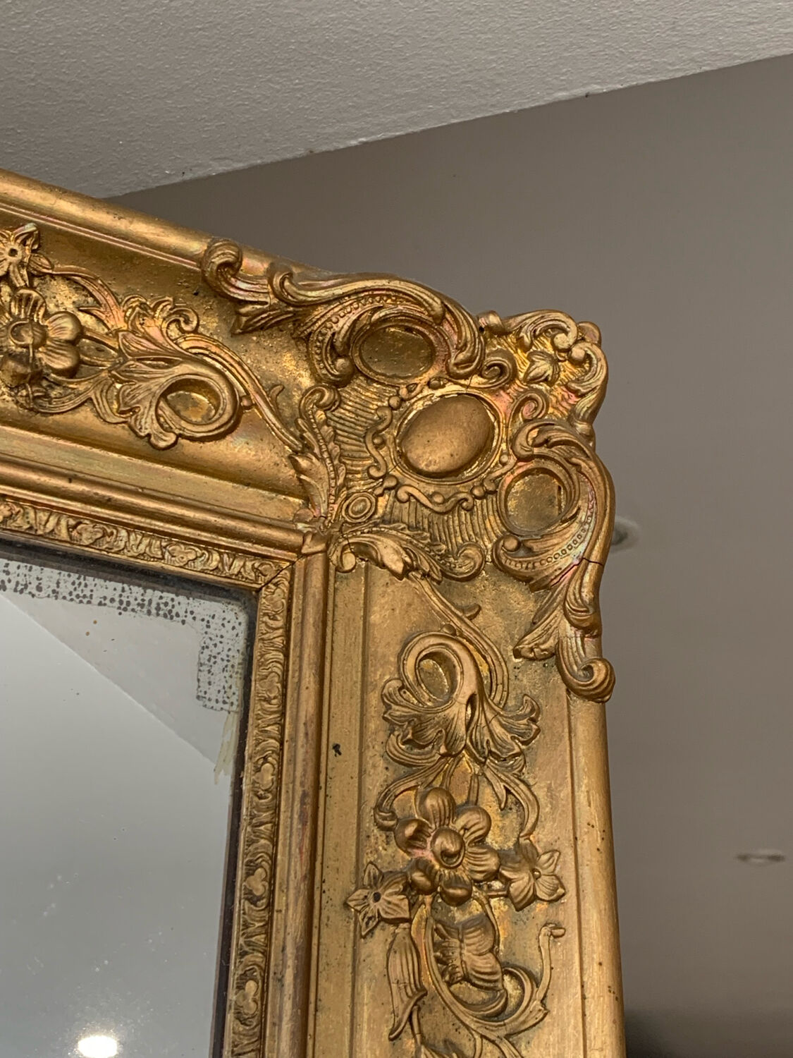 Old gilded mirror fireplace, 19th century restoration