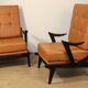 Paire de fauteuils vintage années 50 en bois noir et cuir caramel