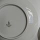 Solitaire tea cup, saucer, and dessert plate in white and gold.