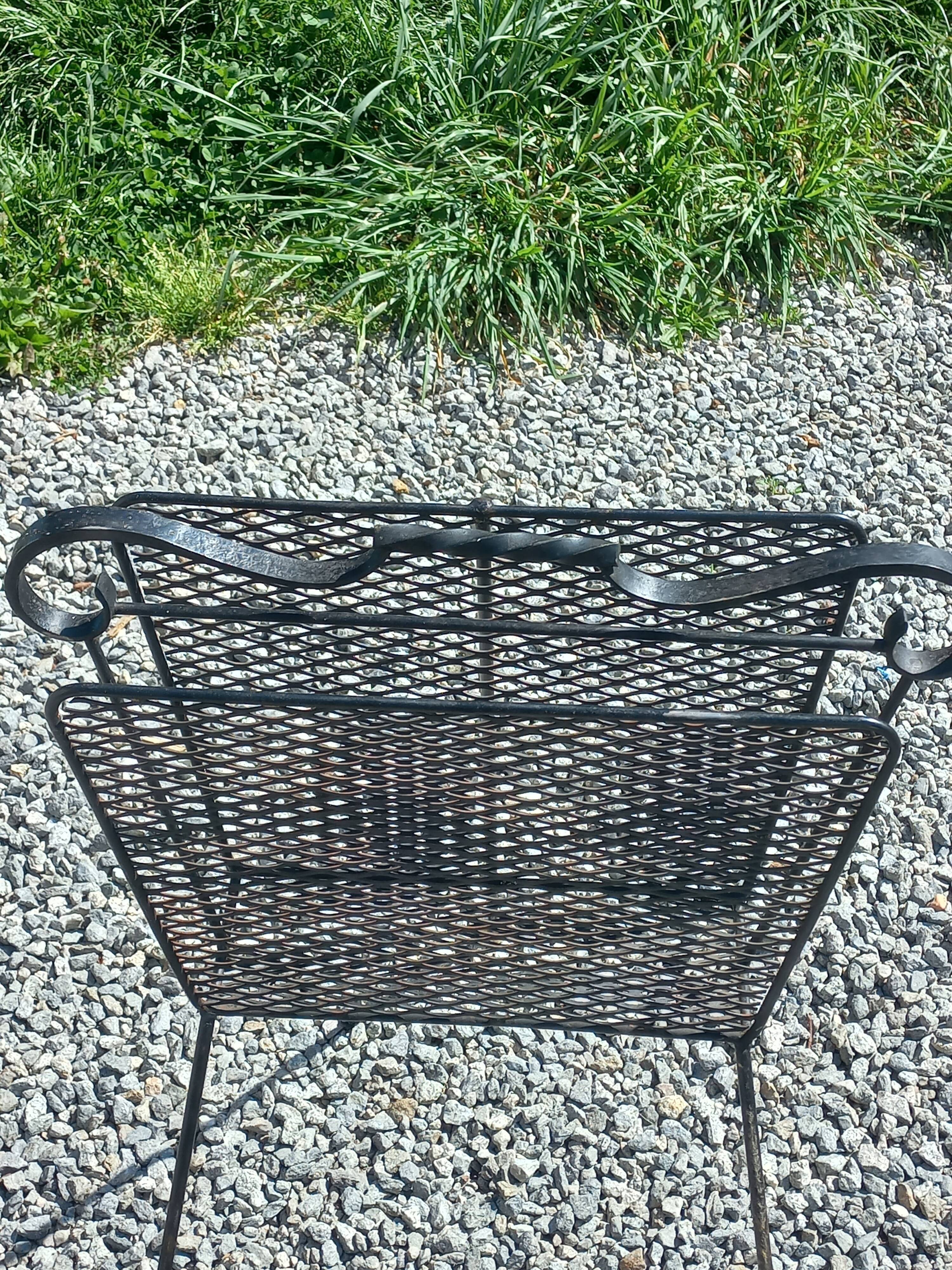 Perforated metal magazine rack from the 1960s.