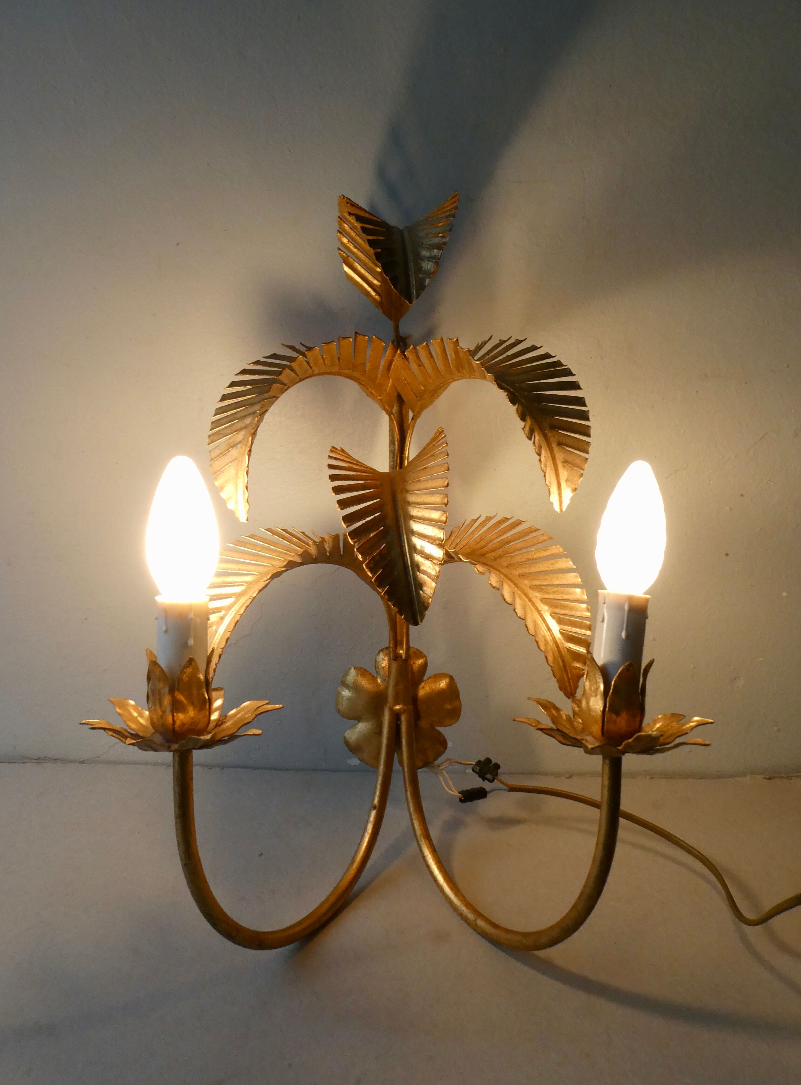 Pair of gold metal palm sconces, 70s