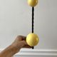Duo of hooks balls in yellow wood and black iron 60s