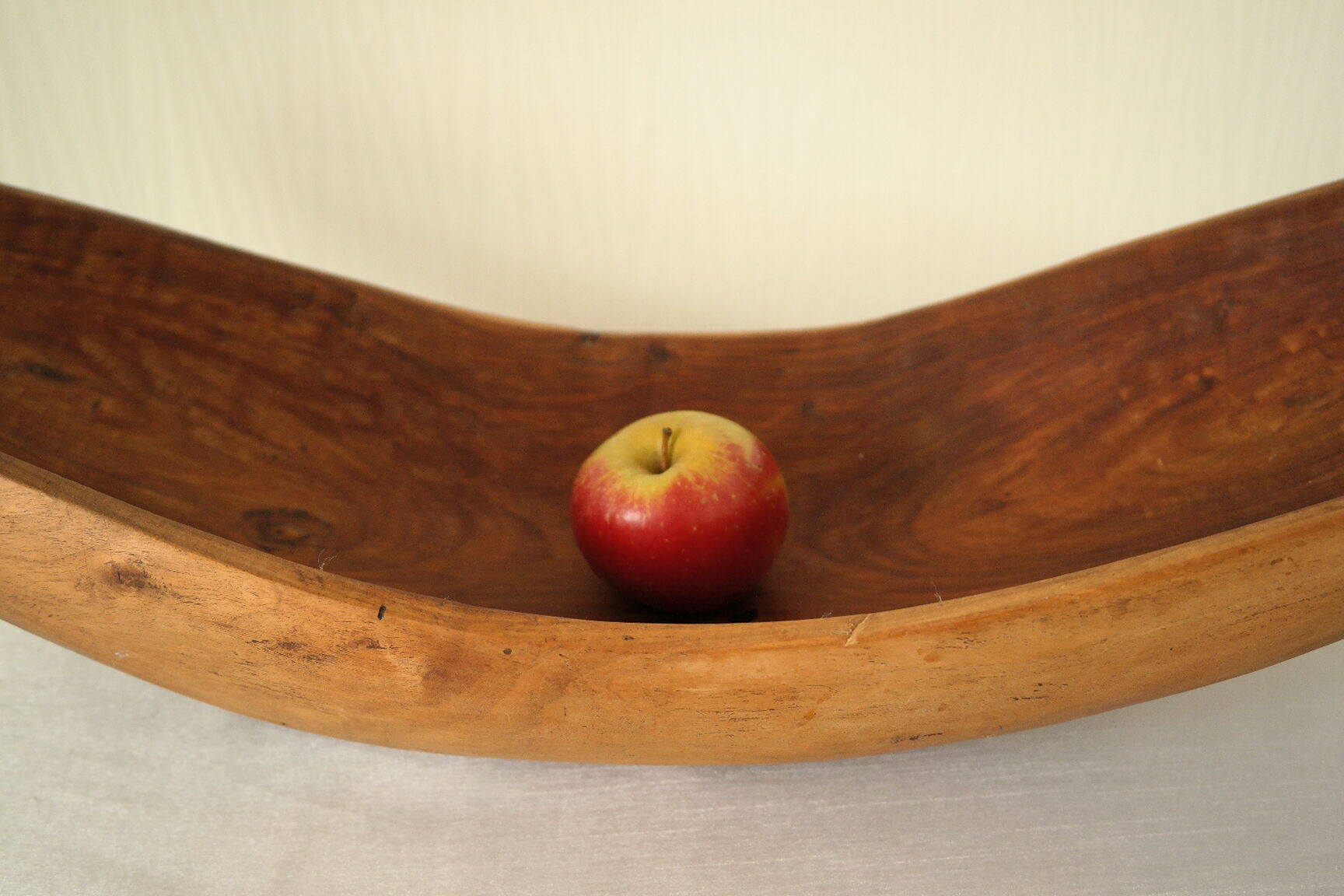 Brutalistic cut in exotic wood boomerang shape