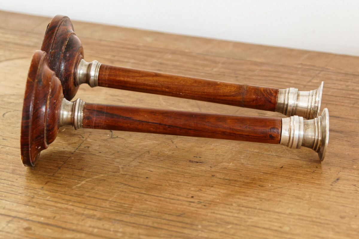 Pair of Indian candle holders, wood and silver metal