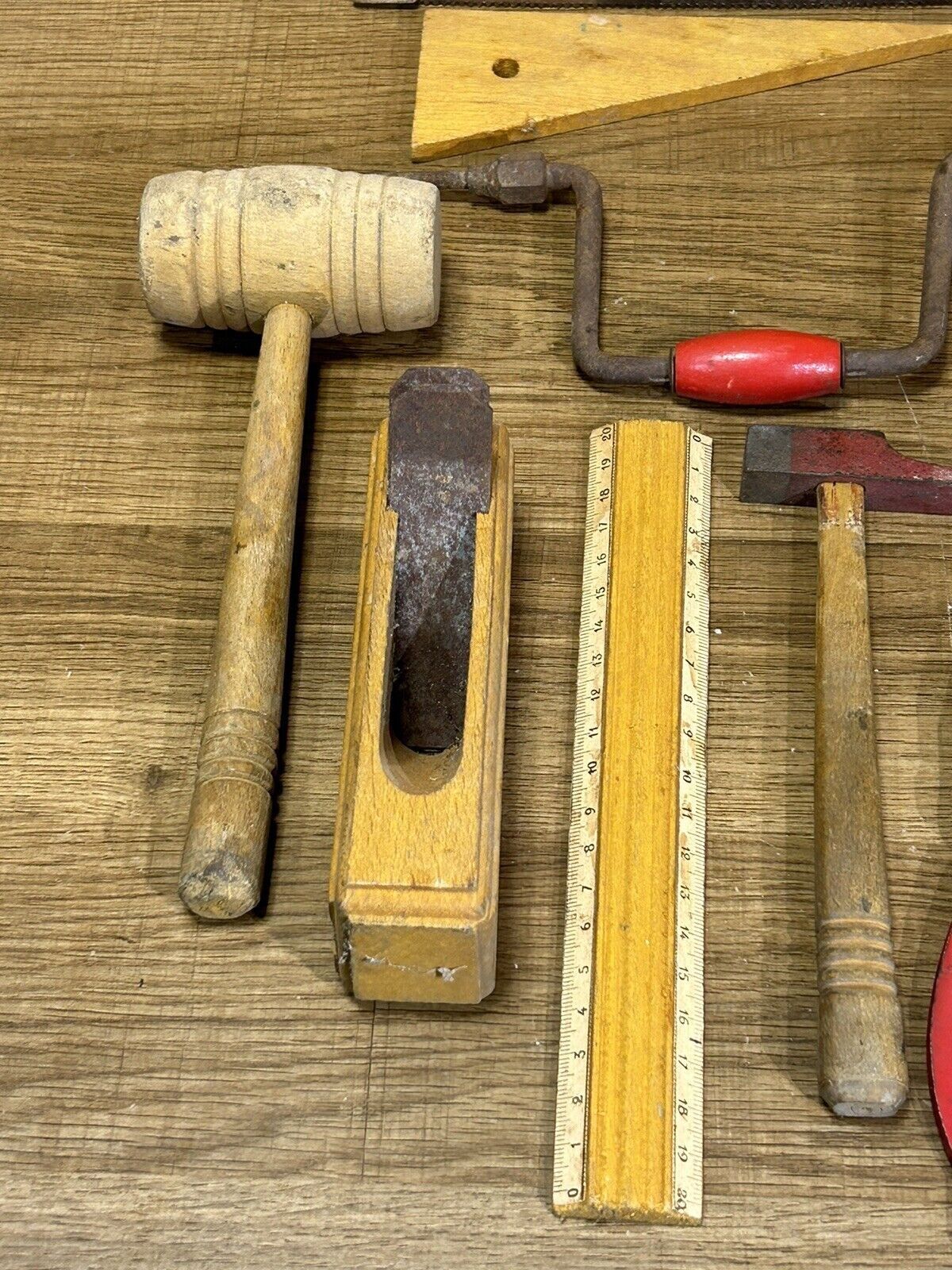 lot of antique toys, carpentry tools, wood, saw, plane, hammer,...