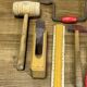 lot of antique toys, carpentry tools, wood, saw, plane, hammer,...