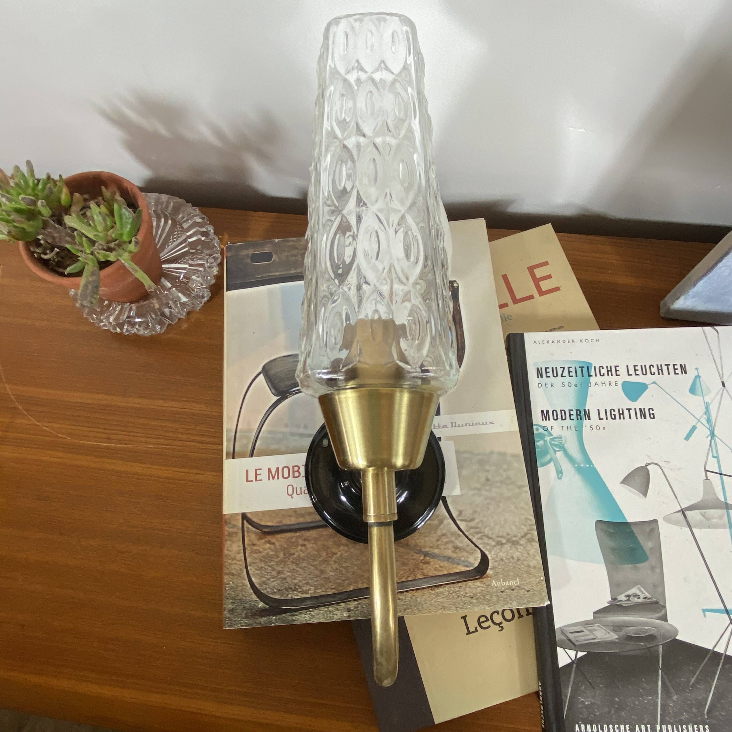 Pair of wall sconces in brass with square tulip glass shades.