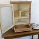 Small glass wall cabinet from the 1960s.
