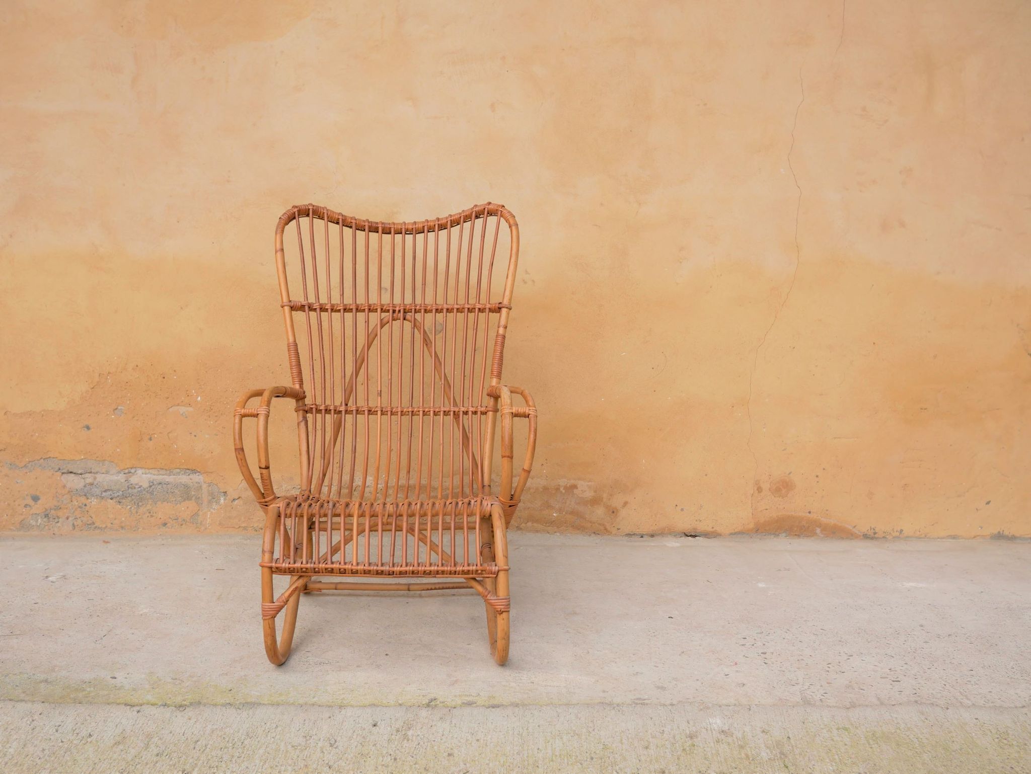 Vintage rattan chair by Louis Sognot