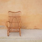Vintage rattan chair by Louis Sognot