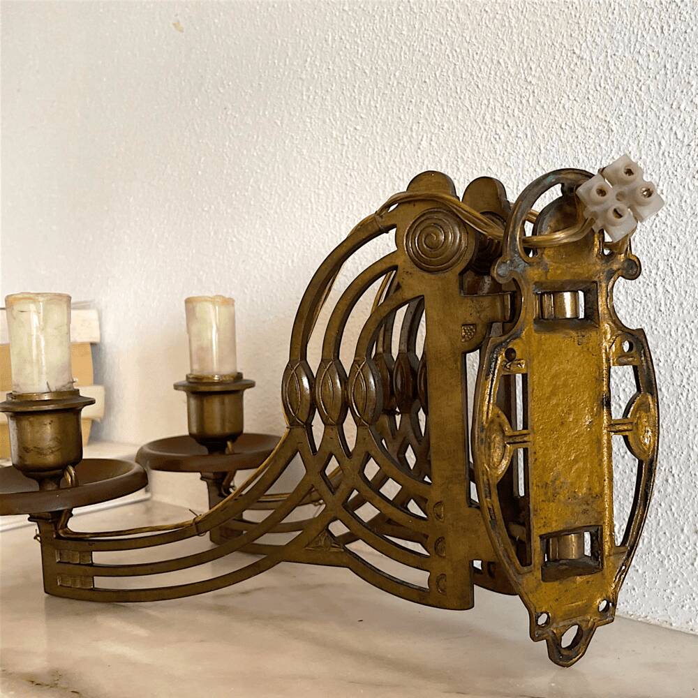 Art Nouveau style brass double piano wall lamp