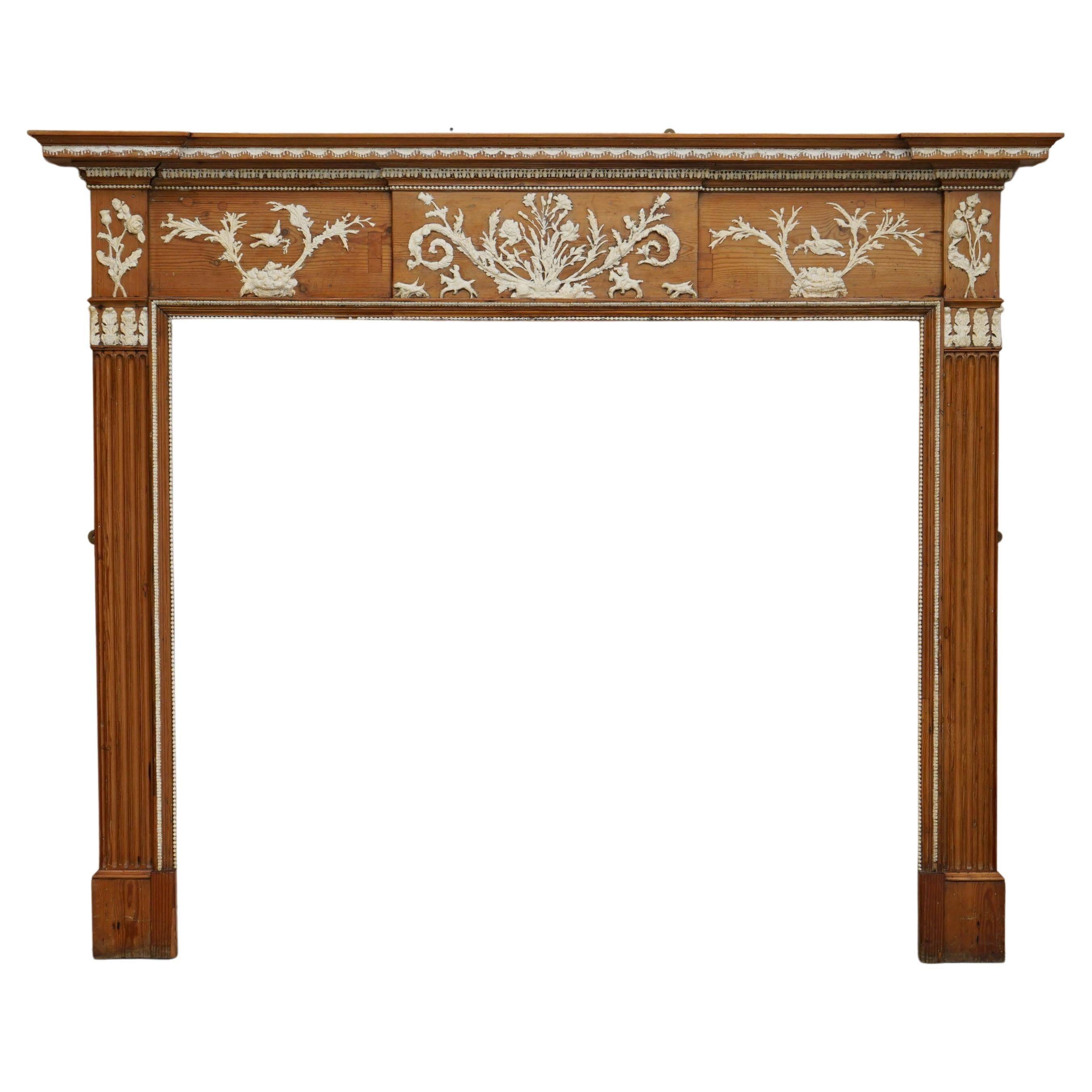 Victorian antique fireplace in tarred pine and sculpted gesso.