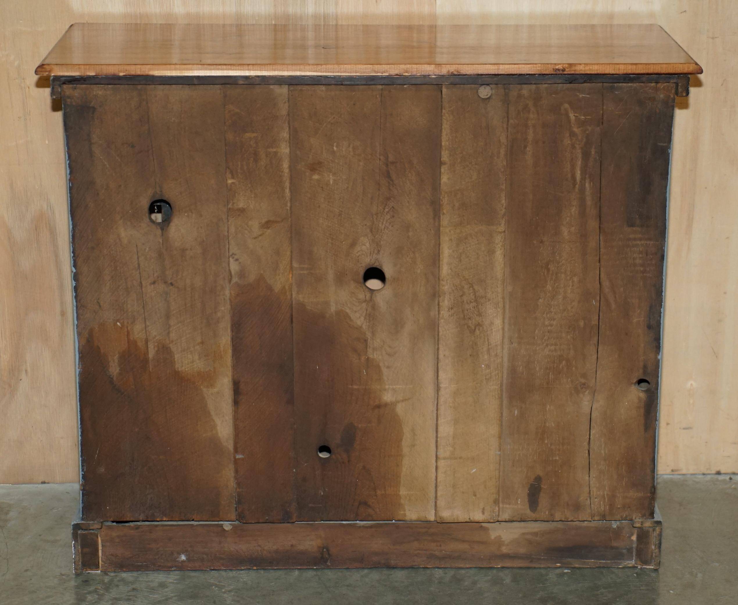 Vintage wooden furniture for 45 wine bottles with a drawer.