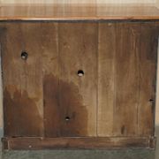 Vintage wooden furniture for 45 wine bottles with a drawer.