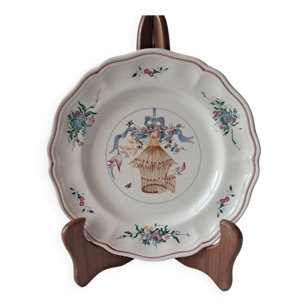 Assiette en faïence de Longchamp. Décor de cage à oiseaux
