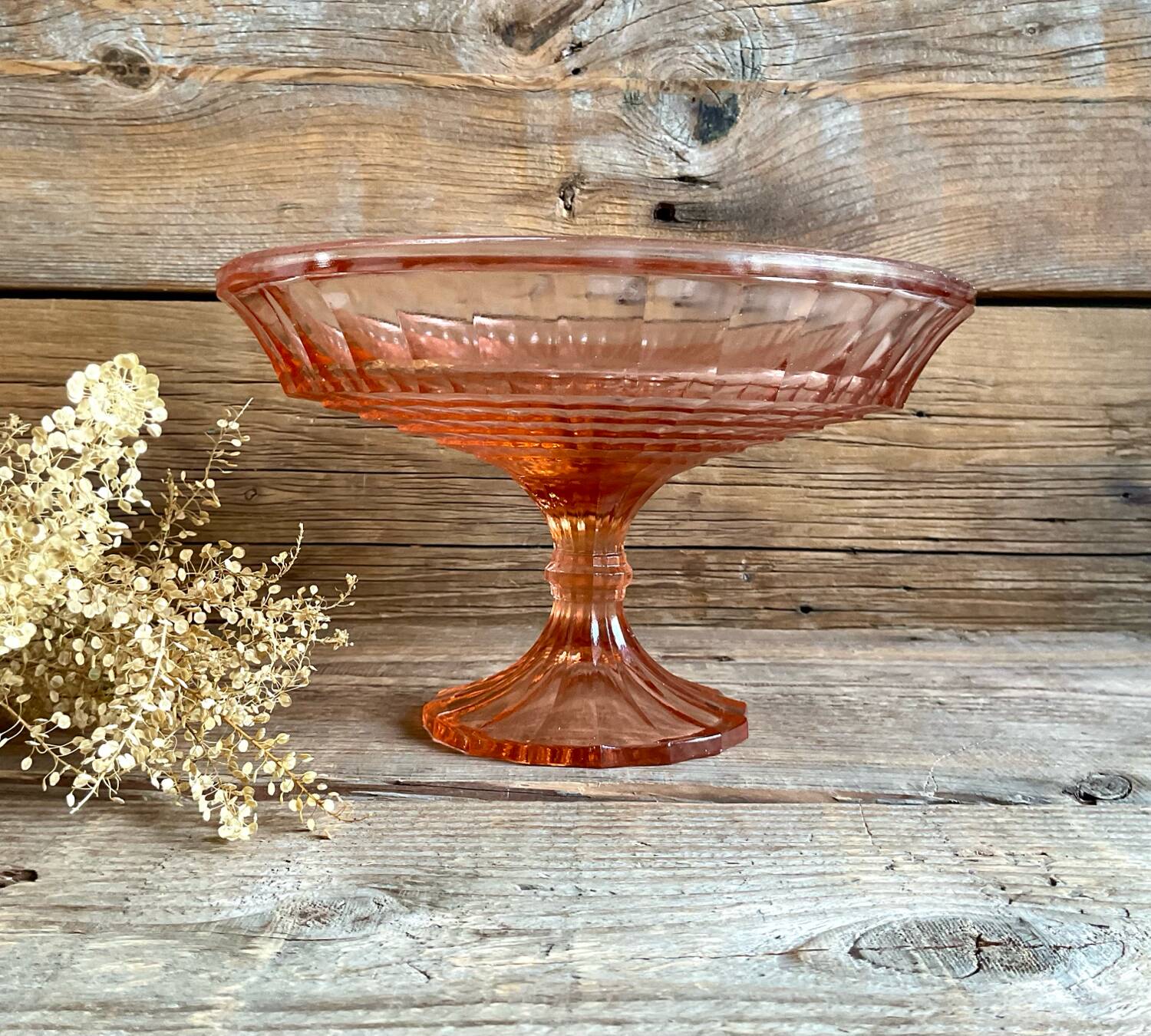 Pink glass cup, fruit bowl