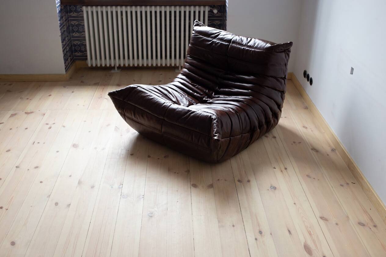 Togo armchair in dark brown shiny leather