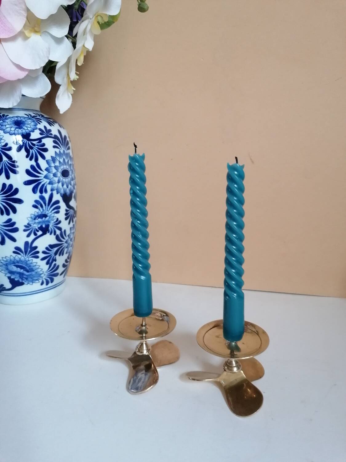 Two brass aviation propeller candle holders