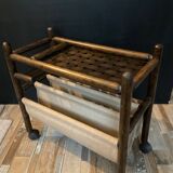Vintage rattan magazine rack on wheels