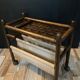 Vintage rattan magazine rack on wheels
