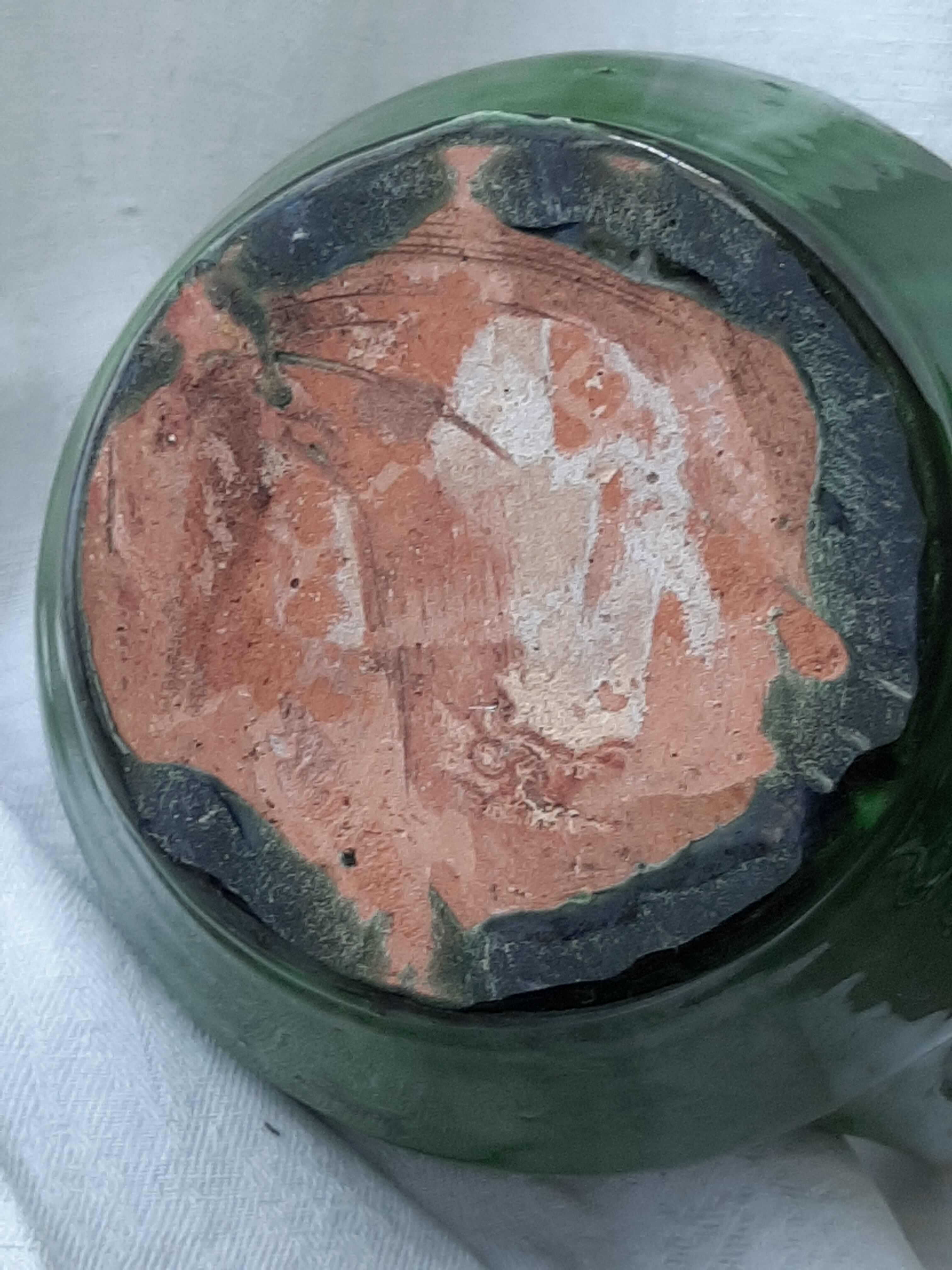 Old glazed terracotta pitcher