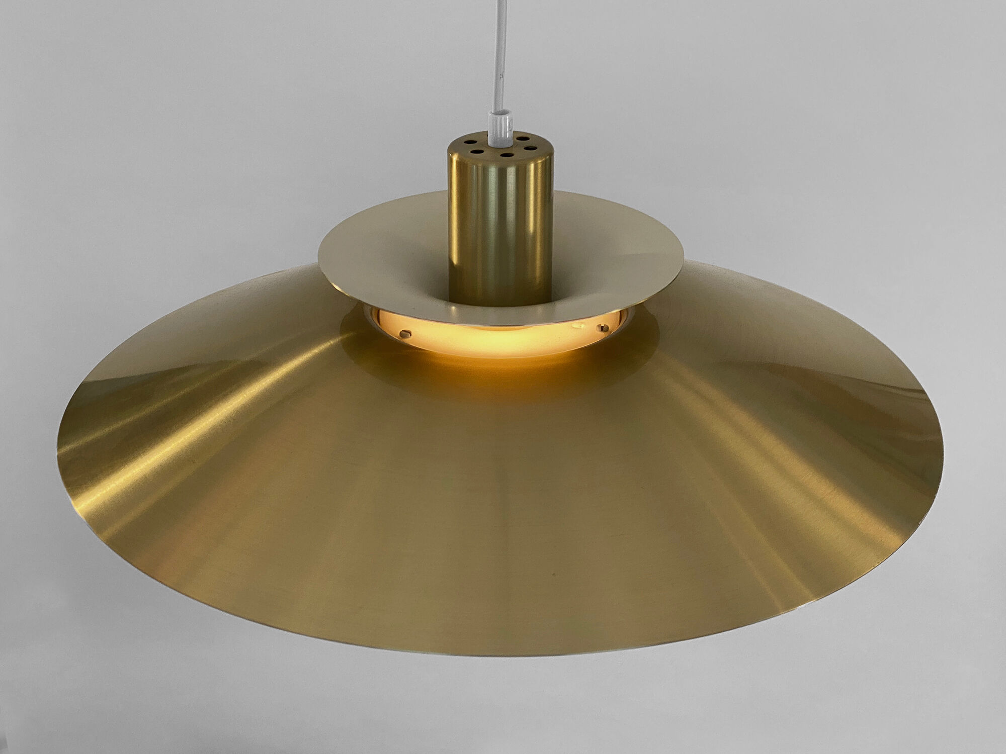 Golden colored aluminum pendant light from Frandsen Lighting. Denmark 1970s