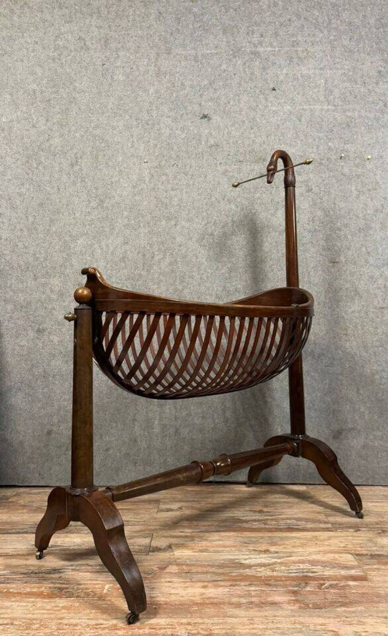 Empire style mahogany cradle with a swan neck, shaped like a cradle, circa 1810