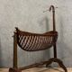 Empire style mahogany cradle with a swan neck, shaped like a cradle, circa 1810