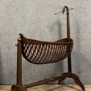 Empire style mahogany cradle with a swan neck, shaped like a cradle, circa 1810