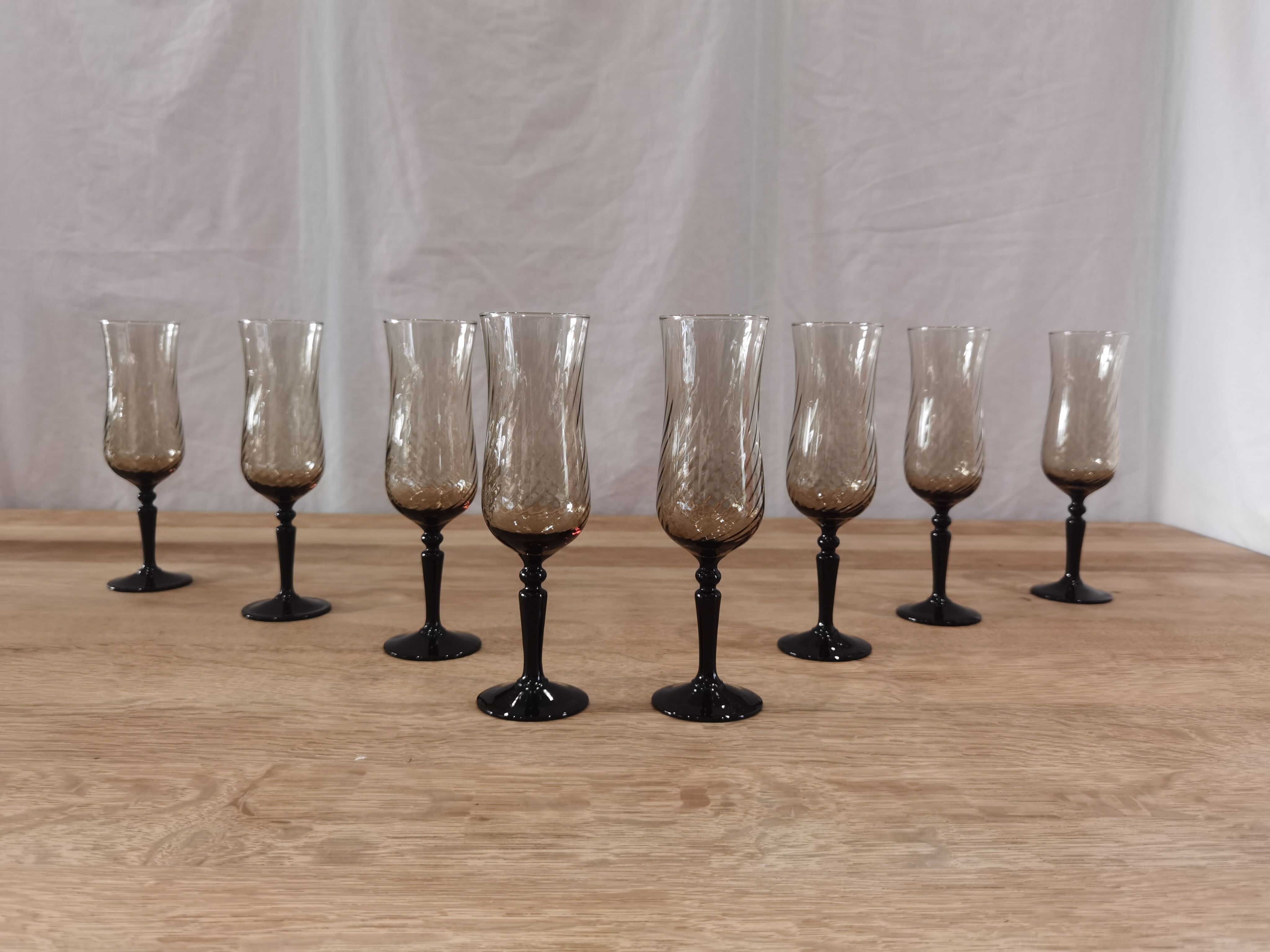 8 vintage smoked champagne flutes with black feet Arcoroc