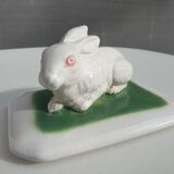 Pot terrine rabbit of Bavent in white earthenware on square of greenery