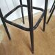 Pair of black metal bar stools and yellow imitation leather seat