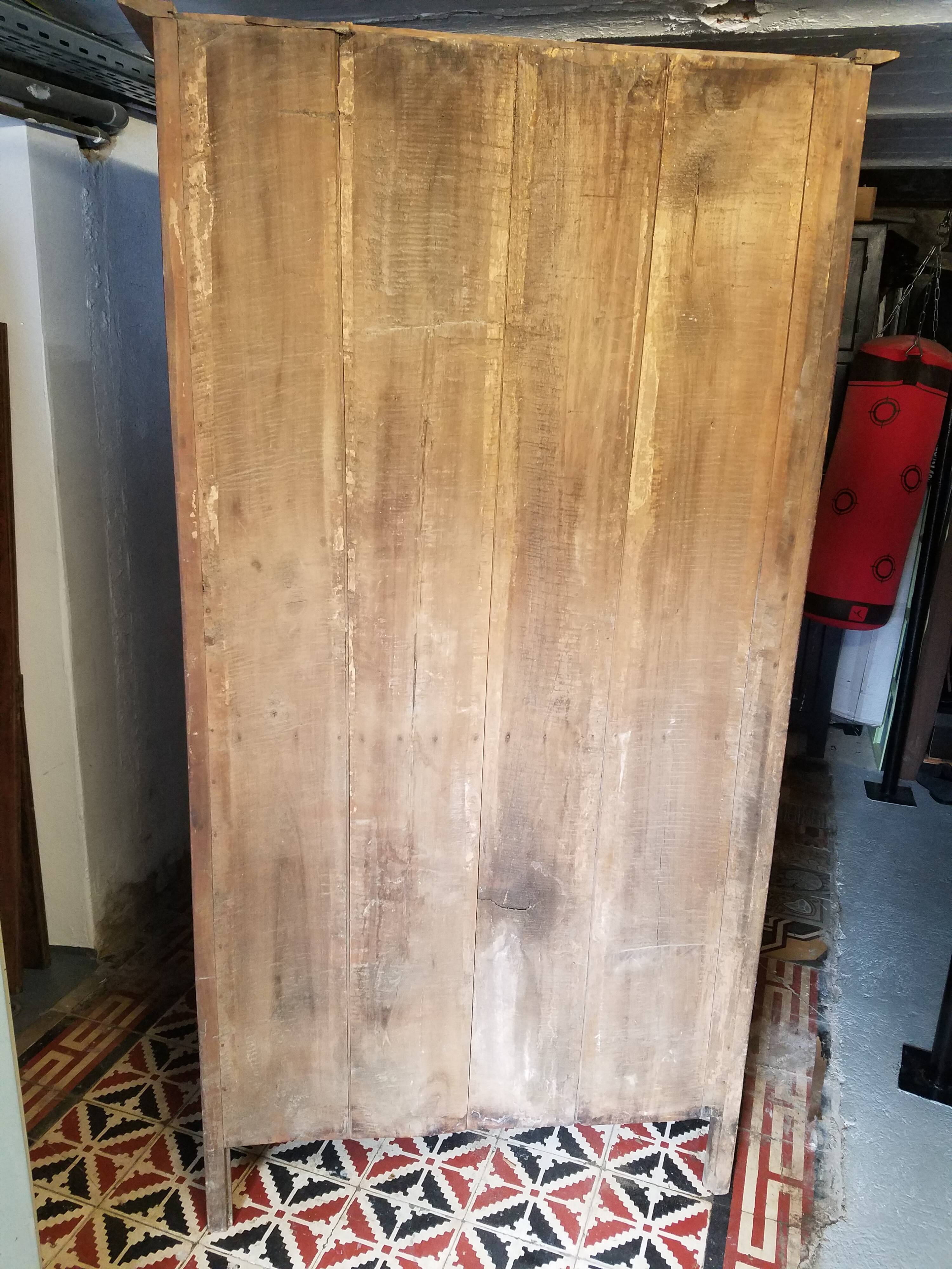 Parisian wardrobe transformed into a library