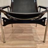 Black leather reclining lounge chair, "Hans Eichenberger" design, 1960.