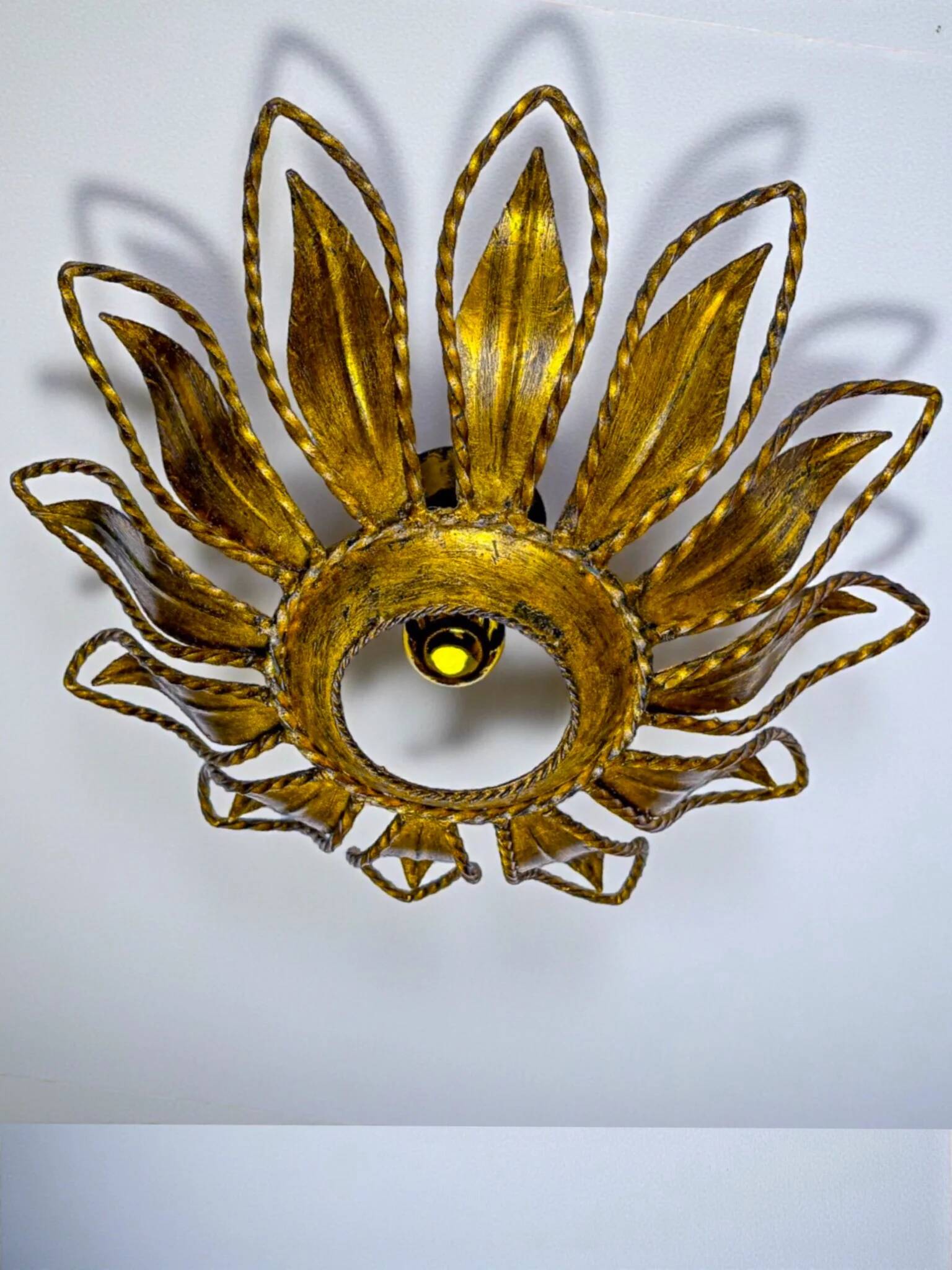Sunburst ceiling light fixture or sconce, gilt iron & exposed bulb France, 1970s