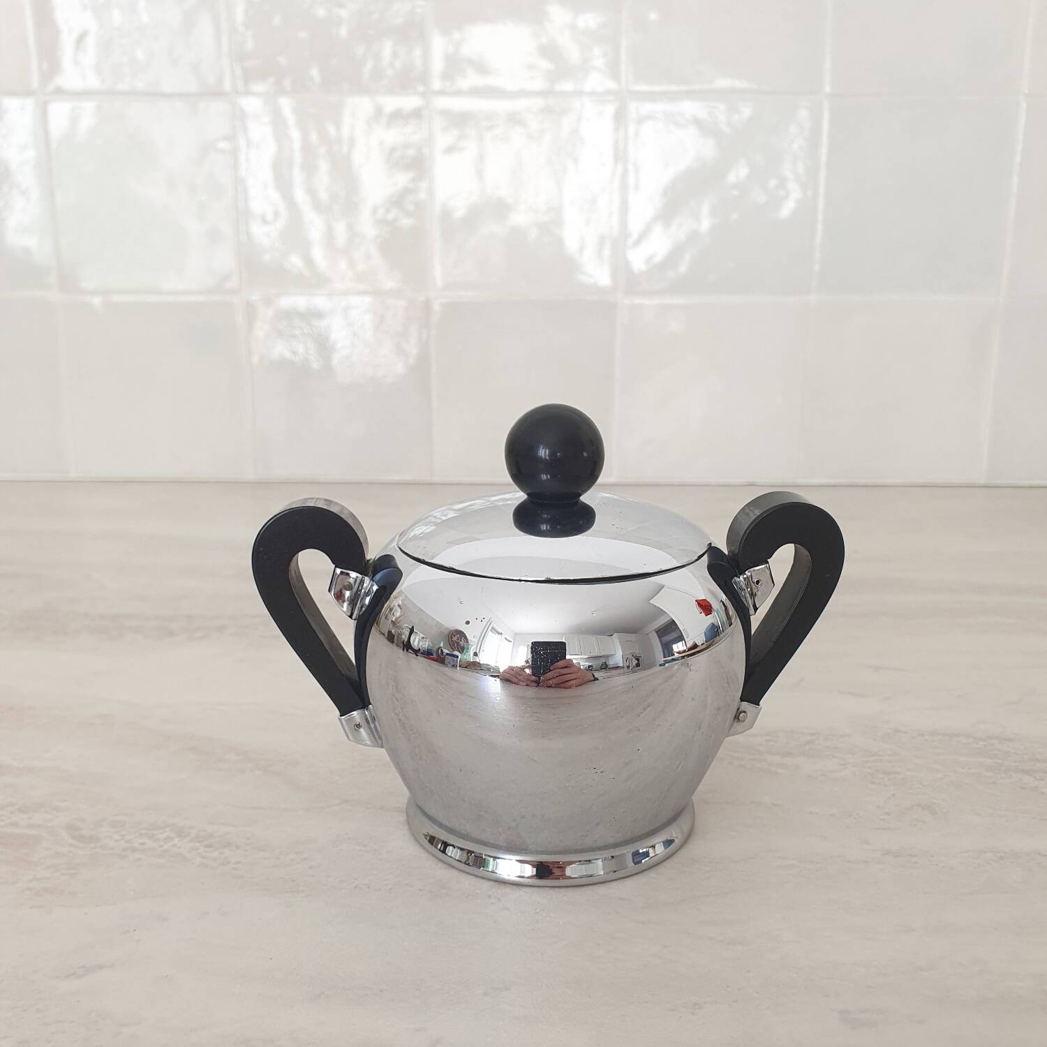 Alessi / Stainless steel and bakelite sugar bowl, "Bombé" collection