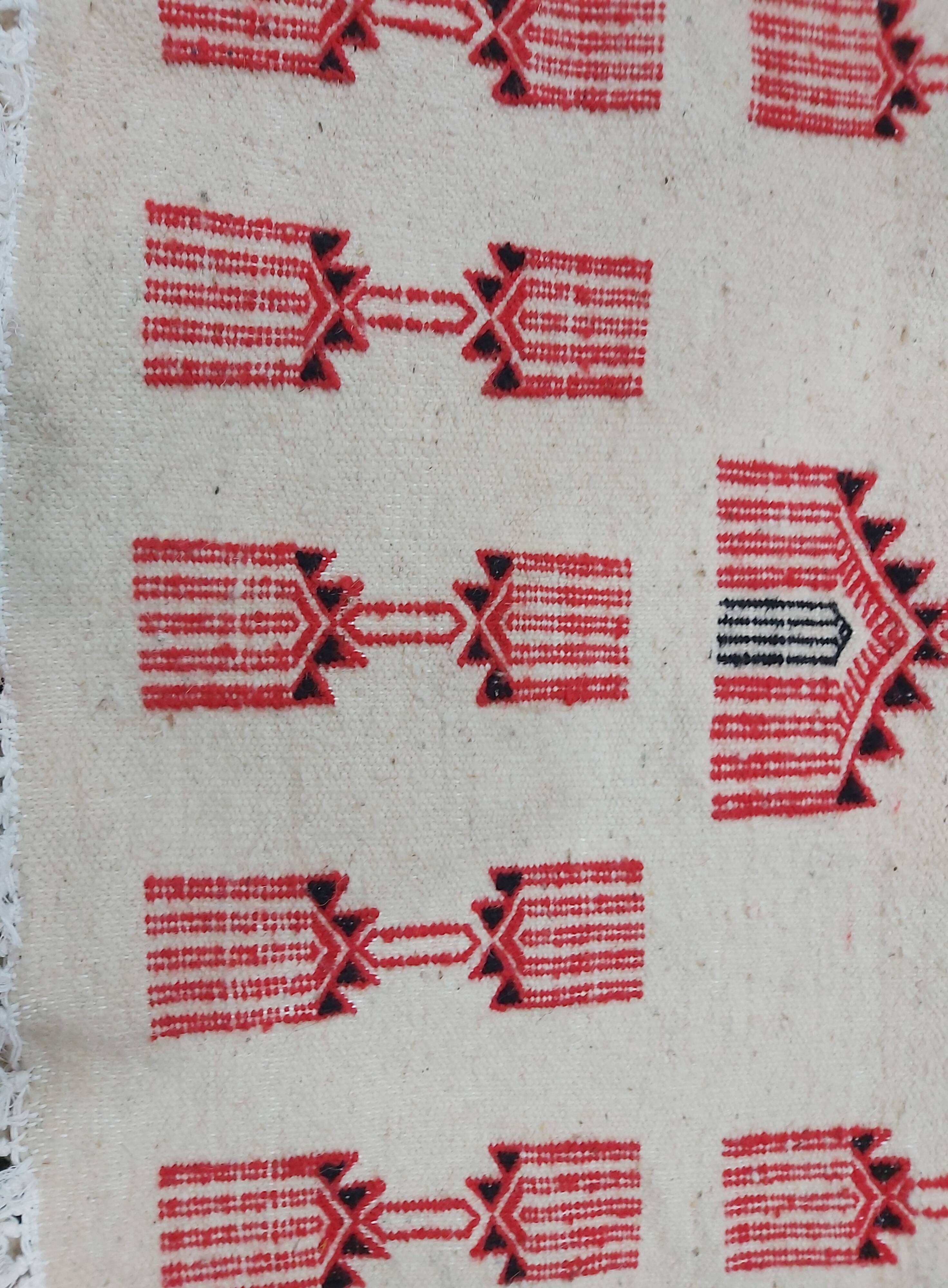 Traditional handmade white and red carpet