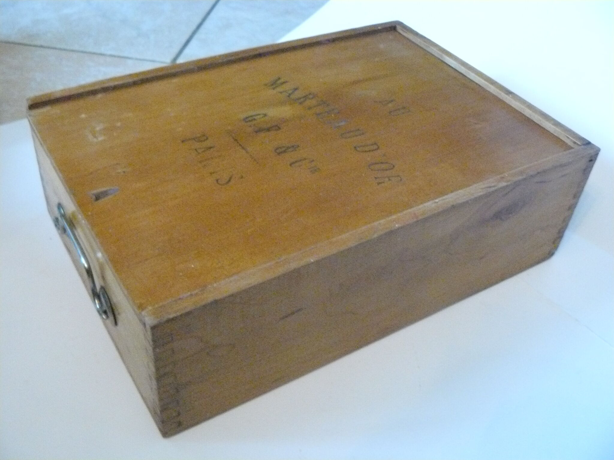 Wooden storage box marked "with a golden hammer"