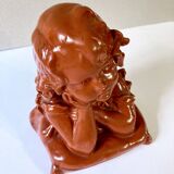Bust of a pensive child in plaster