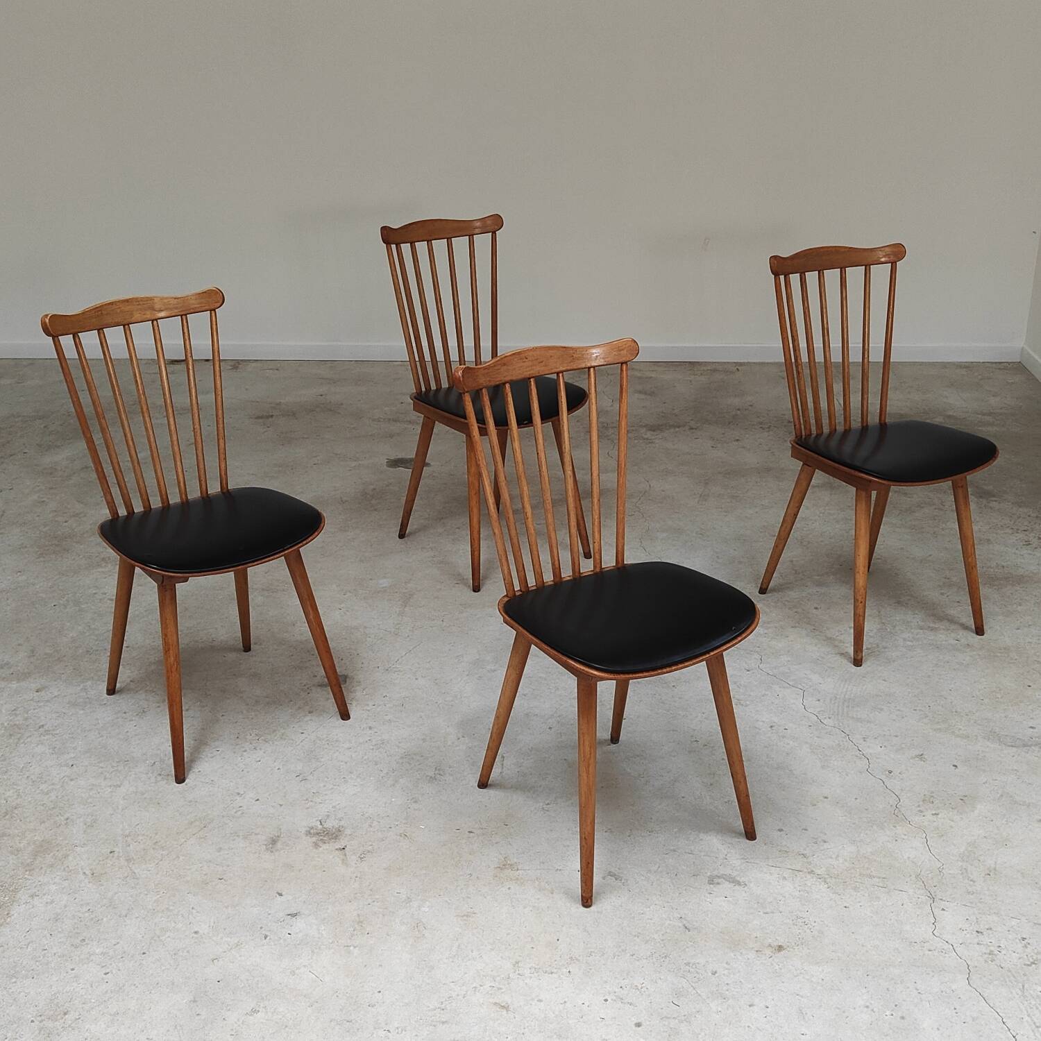 Set of 4 Baumann Menuet chairs black leatherette compass legs