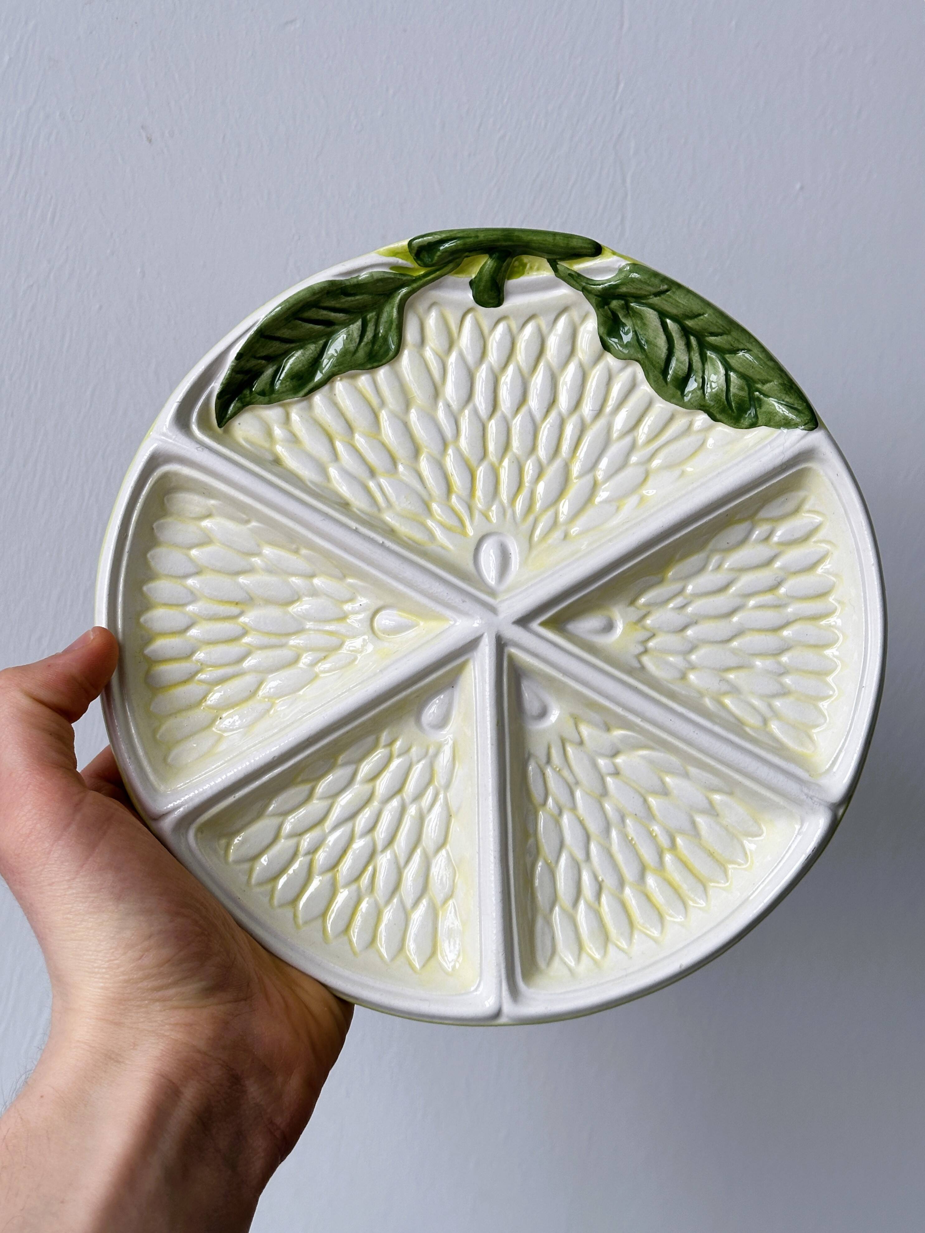 2 ceramic plates depicting a lemon