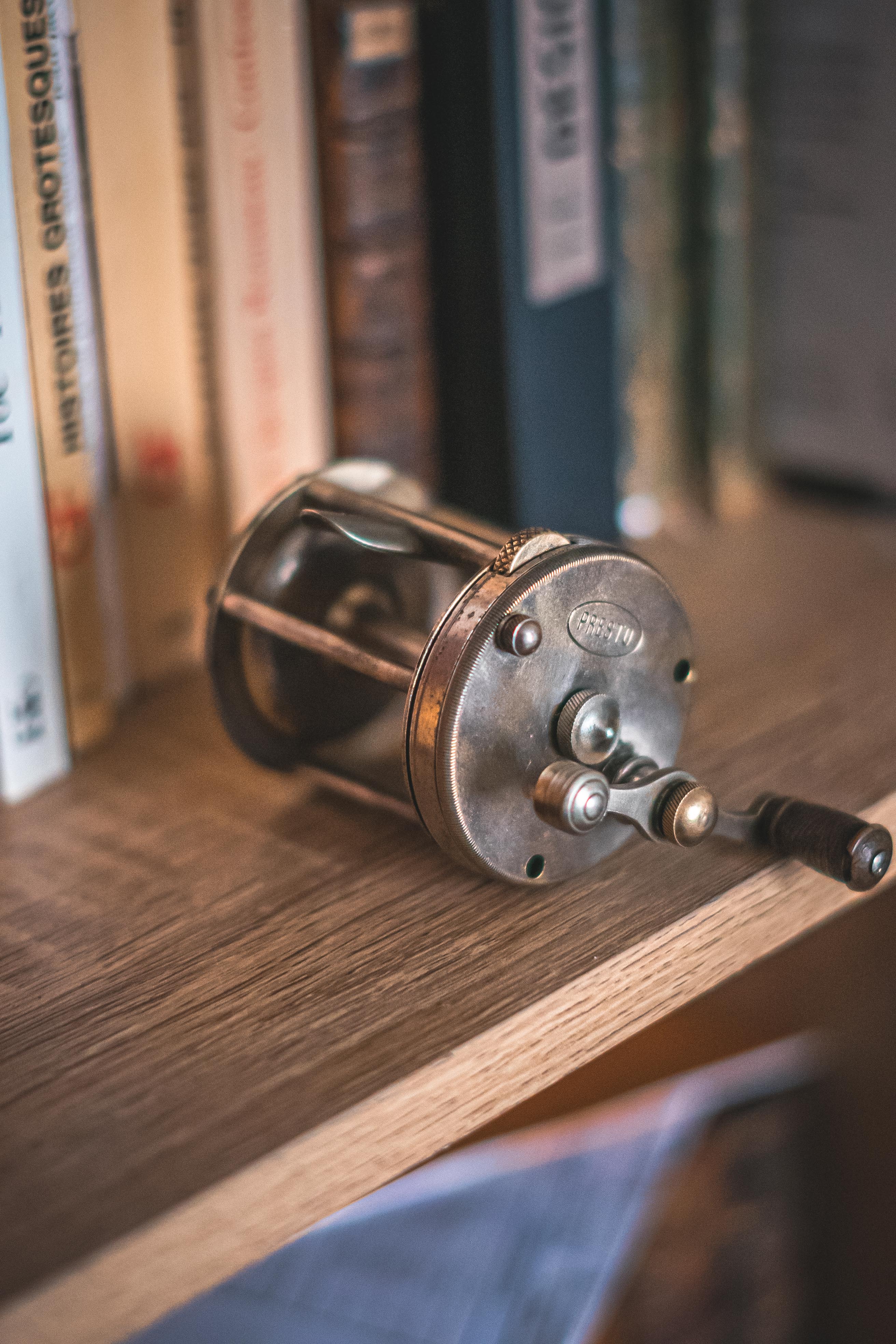 Old little fishing rod reel presto with bone handle fisherman collection