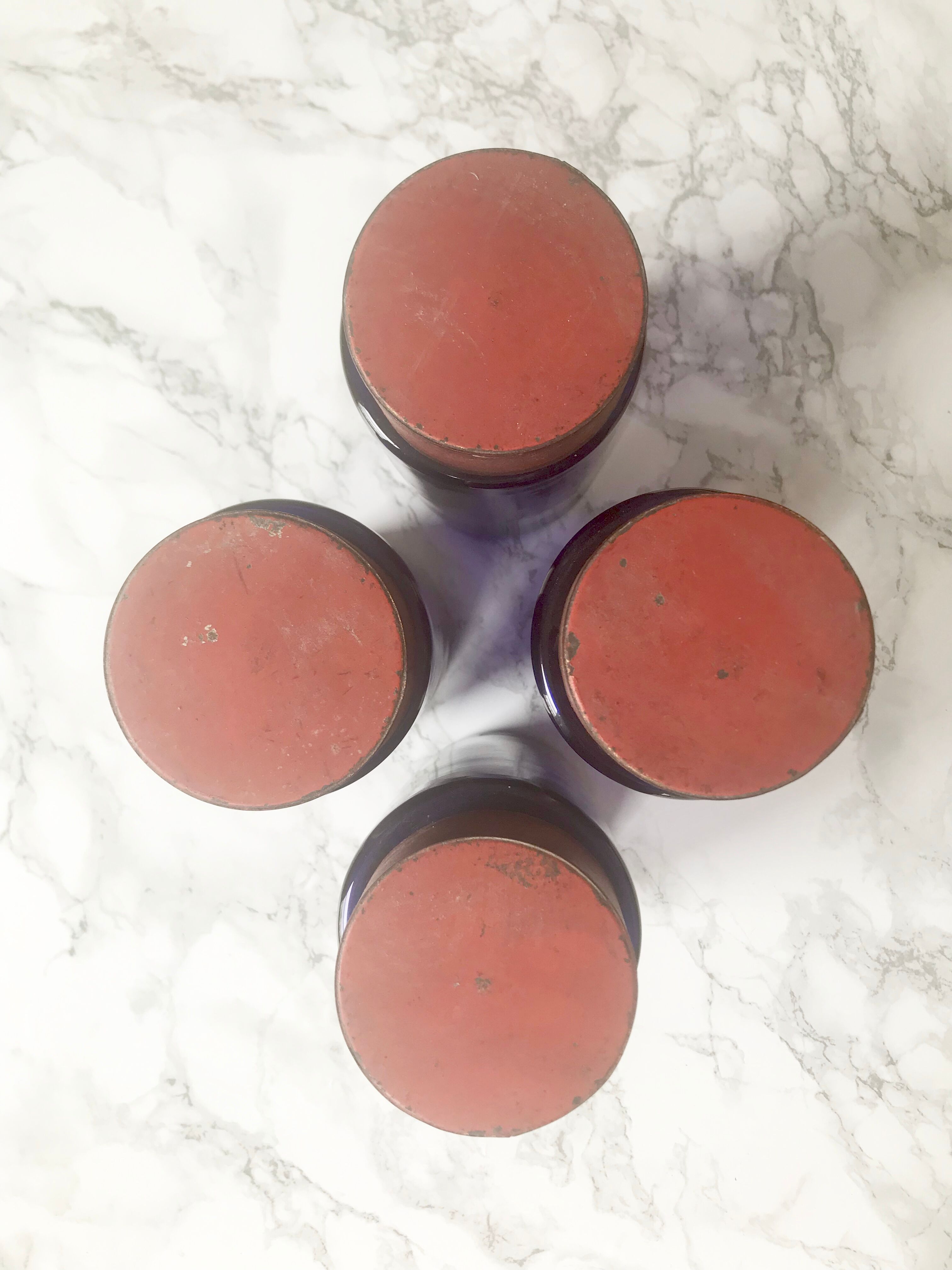 Suite of four bottles of ancient apothecary in blue breath glass