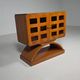 Mid-century modern mobile bar cabinet with sculptural base, 1950s.