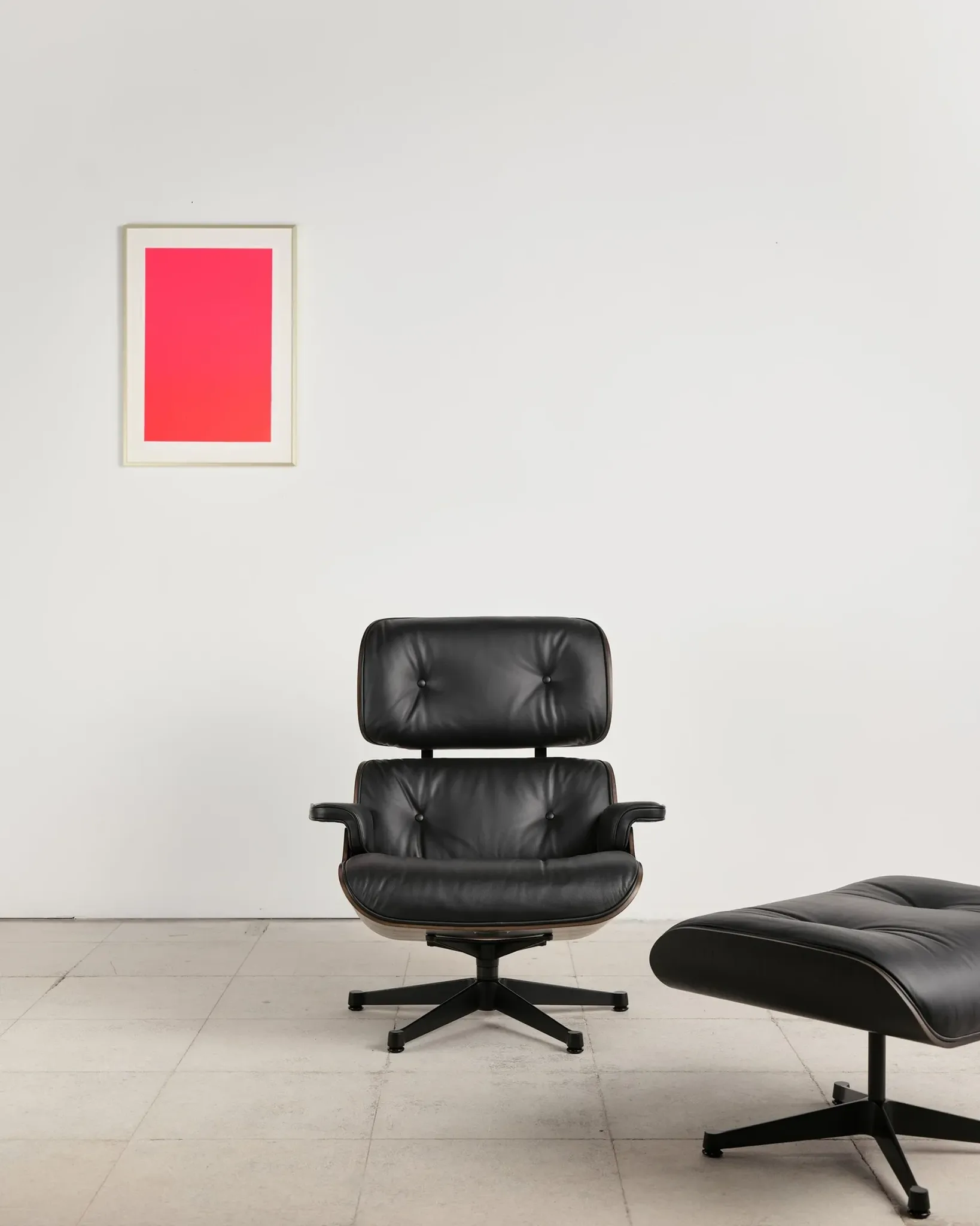 Lounge Chair and ottoman in black leather by Charles & Ray Eames, Vitra