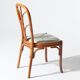 Pair of rattan and blue floral fabric chairs