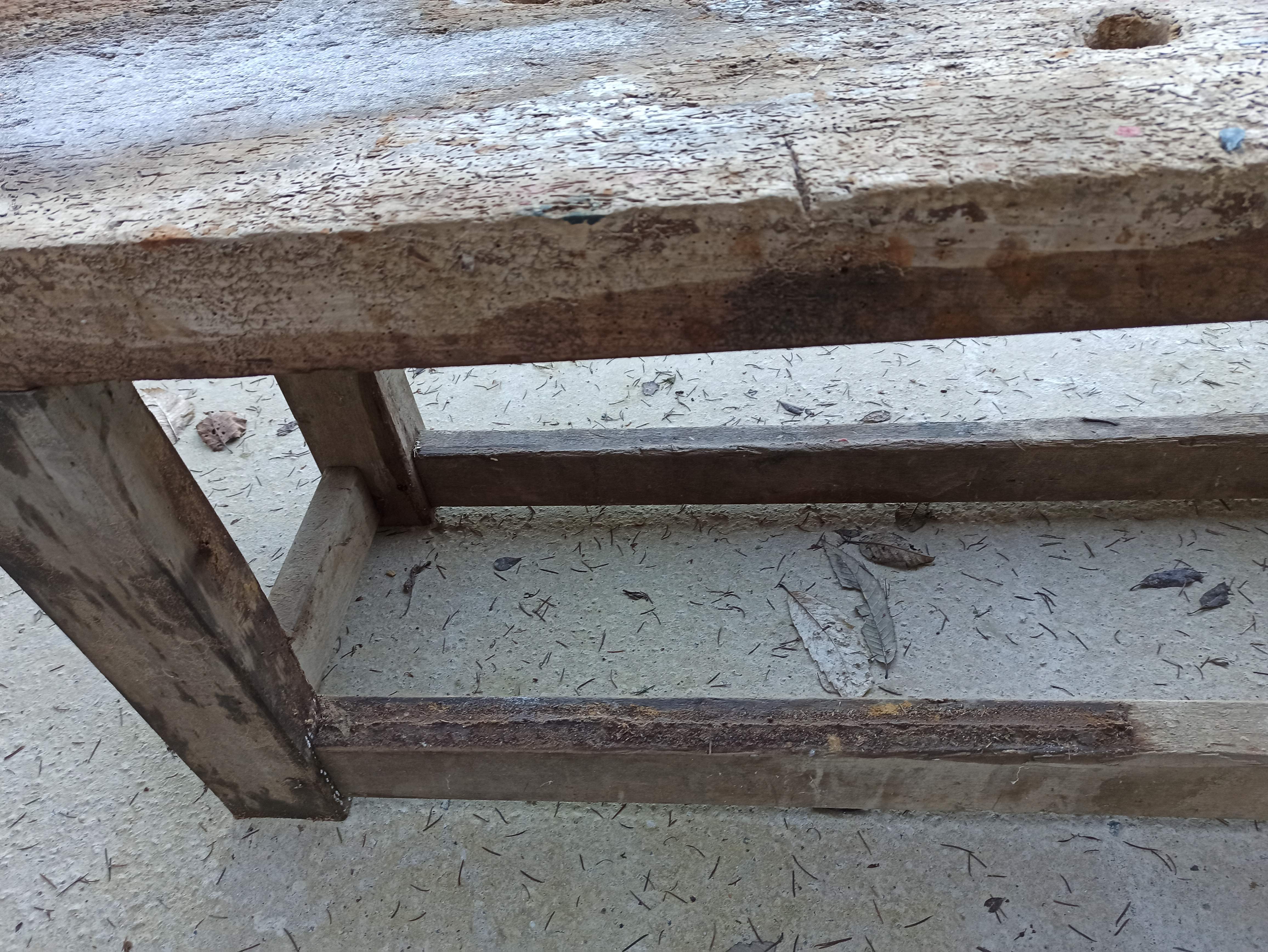 Wooden carpenter's workbench with iron and wooden vice