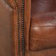 Vintage sheepskin club armchair in English style with deep colours